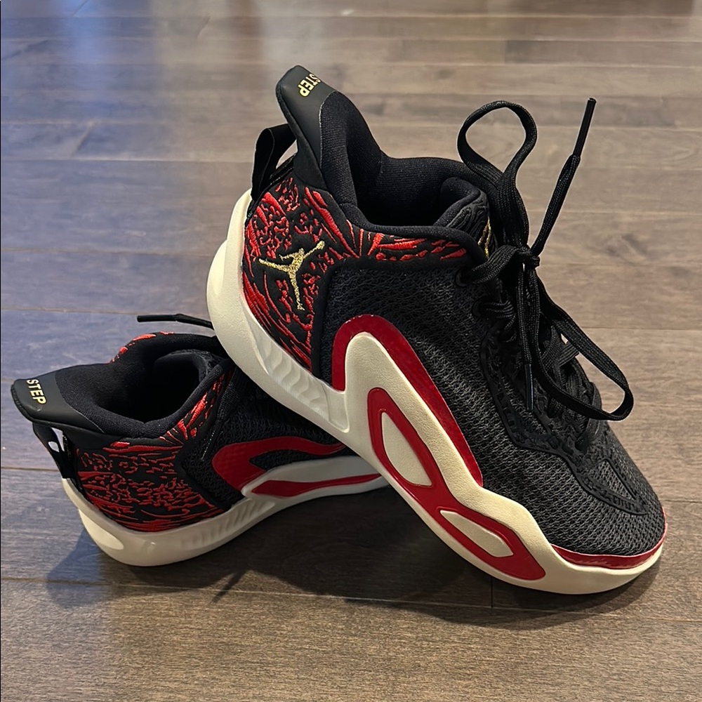 Black and Red Sneakers with Intricate Pattern